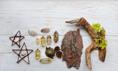 Wall Mural - Crystal minerals and magical items on white wooden background. magic esoteric ritual for home protection. Mysticism, divination, wicca, occultism concept. flat lay