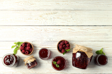 Wall Mural - Flat lay composition with raspberry jam on wooden background