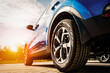 © Iryna - Blue Family business spotrs hatchback Car on sunset. Business success concept