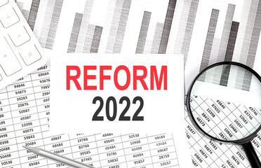 Poster - REFORM 2022 text on the paper with calculator,pen on graph background