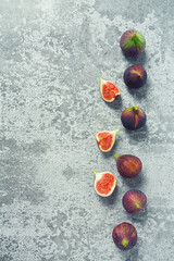 Wall Mural - fresh figs on grey stone surface