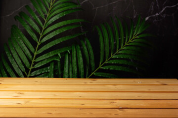 wooden table for show product display and presentation, summer and palm leaves background, copy space.