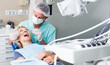 © JackF - Male dentist with female patient during oral checkup in dentistry