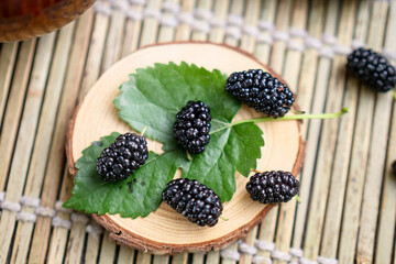 Wall Mural - Ripe large black mulberries close up