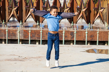 Wall Mural - Happy young beautiful african little boy