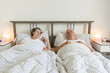 senior aging married couple man male and female woman sleep together in bed apartment sexual problems dysfunction