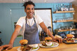 © BalanceFormCreative - Portrait of young waiter.He standing in his bar and looking at camera.