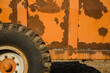 Detail of the wheel and trailer of a tractor with rusted paint