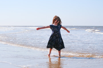 Wall Mural - woman running on the beach