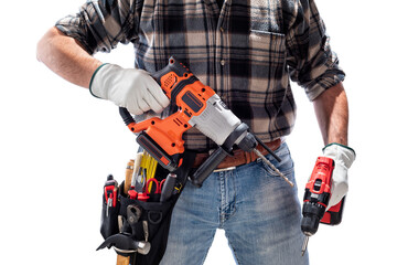 Wall Mural - Carpenter holding rechargeable hammer drill and the rechargeable screwdriver, isolated on white background. Work safety.