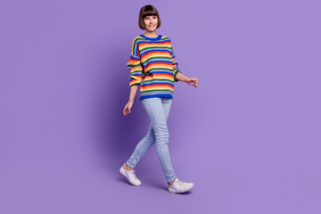 Sticker - Photo of pretty cheerful positive lady walk travel wear striped pullover jeans shoes isolated violet color background