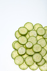 Poster - Top view of freshly sliced cucumber isolated on white background