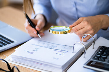 Canvas Print - Lawyer Examining Invoice Using Magnifier Glass