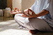 © Milles Studio/Stocksy - Woman gesturing Gyan mudra during meditation