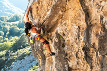 Mature Sportswoman Rock Climbing