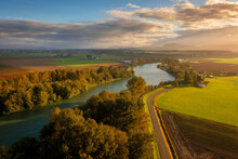 Autumn Morning On The Skagit River In The Skagit Valley.  Aerial Drone View Of This Beautiful River With The Cascade Mountains In The Background.