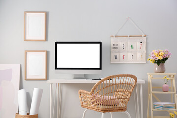 Canvas Print - Comfortable workplace with modern computer and flowers in room. Interior design