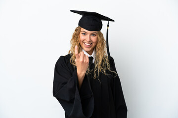 Wall Mural - Young university graduate isolated on white background doing coming gesture