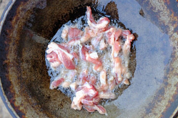 Wall Mural - Pieces of pork deep fried on a pan. Top view.