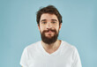 © SHOTPRIME STUDIO - bearded man in a white t-shirt expressive look Studio
