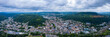 Aerial view around the city Merzig on a cloudy day in summer