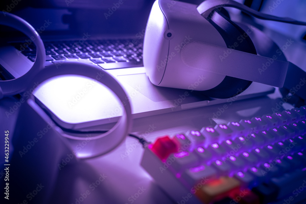 Virtual reality devices on the desk. Laptop VR 3D viewer air joystick ...