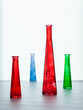 COLORED glass vases on a white table