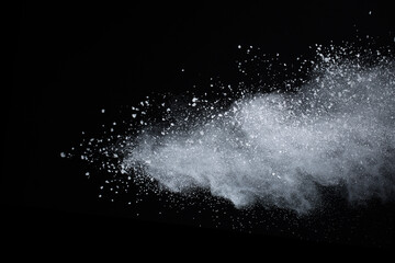 Wall Mural - white powder explosion on black background. colored cloud. colorful dust explode. paint holi.