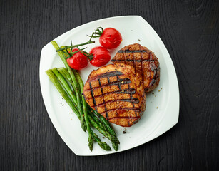 Wall Mural - Freshly cooked veal steak with sides on plate