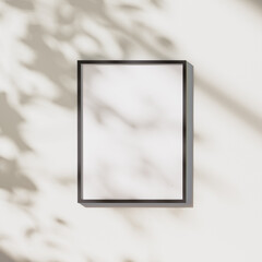 Wall Mural - blank black vertical frame mock up with leaves shadows and sunlight on white wall background, 3d ren