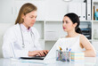 © JackF - Young woman having consultation with female doctor in hospital