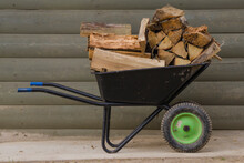 Trolley With Firewood. Heating In The Village