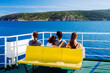 © bubutu - Family - mother with three daughters - on the ferry. The beginning of vacation - sea journey concept