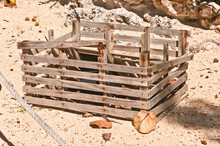 Top, Front View, Medium Distance Of A Deteriorating, Wood Lobster Cage, On An Isolated Beach, On A Sandy Tropical Island Beach