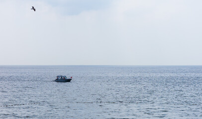 Ships and yachts at sea near the coast of Turkey on a summer day