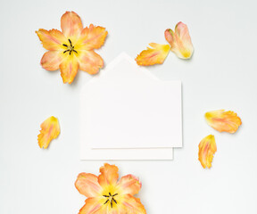 Wall Mural - Feminine floral flat lay with blank stationery and tulips