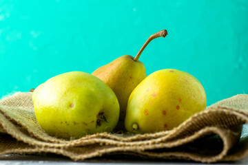 Wall Mural - juicy ripe pears on the table close-up