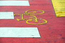 Sign Of Bicycle On A Red Cycling Lane