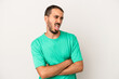 © Asier - Young caucasian man isolated on white background funny and friendly sticking out tongue.