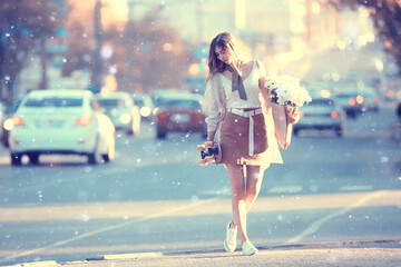 Wall Mural - poplar fluff girl happiness / young adult girl in the urban landscape, happy cheerful model