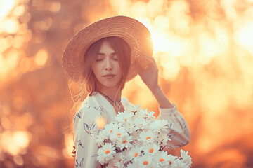 Wall Mural - happy girl with flowers in the city / summer photo young beautiful girl holding a bouquet of flowers