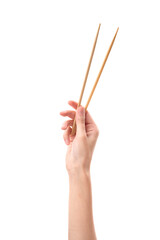 female hand holds Wooden chopsticks isolated on white background.