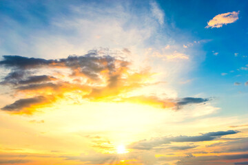 Wall Mural - Sky blue and orange light of the sun through the clouds in the sky