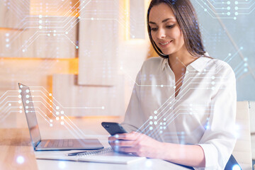 Wall Mural - Attractive businesswoman in white shirt using smart phone to optimize development by implying new technologies in business process. Hi tech hologram over modern office background.