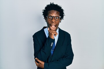 Poster - Young african american man wearing business suit and tie celebrating crazy and amazed for success with open eyes screaming excited.