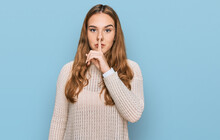Young Blonde Woman Wearing Casual Clothes Asking To Be Quiet With Finger On Lips. Silence And Secret Concept.