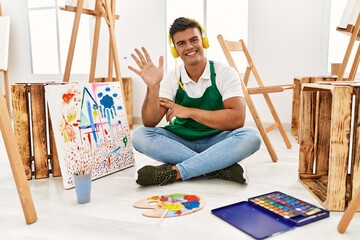 Poster - Young hispanic man at art studio showing and pointing up with fingers number five while smiling confident and happy.