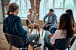 © HBS - Picture of support group during meeting with professional therapist.