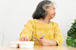 Unhappy Asian senior woman anorexia and say no to ready meals, Elderly home alone and bored food and no appetite