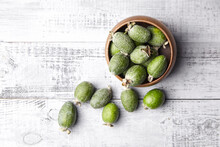 Feijoa Fruits Or Pineapple Guava In Bowl On Wooden Table Top View